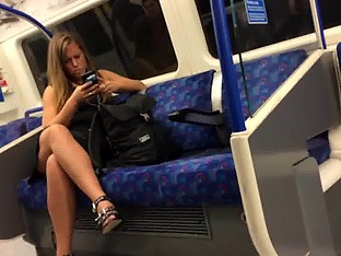 Tanned British Woman showing Legs on Tube